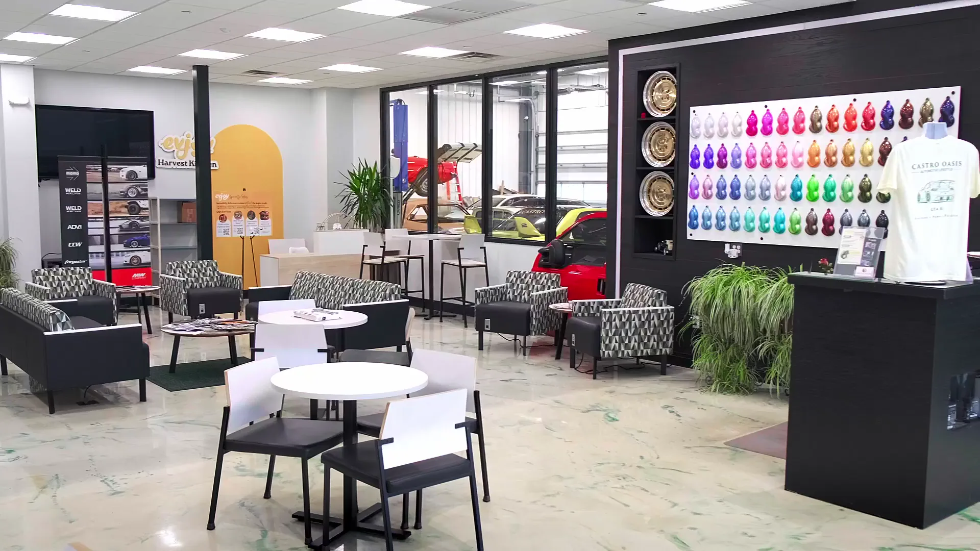 The customer lounge with seating and the wrap and tint colour swatch wall.